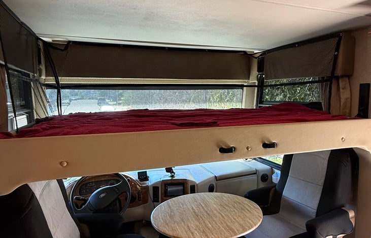 Retractable double bed. Sleeps 2 comfortably. (ladder not pictured)