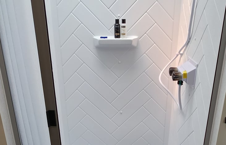 Private bath connects bedroom to the living space.  Sliding doors on each side for privacy.