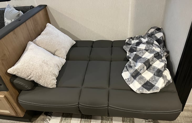 Love seat opened to a small bed( great for small children)