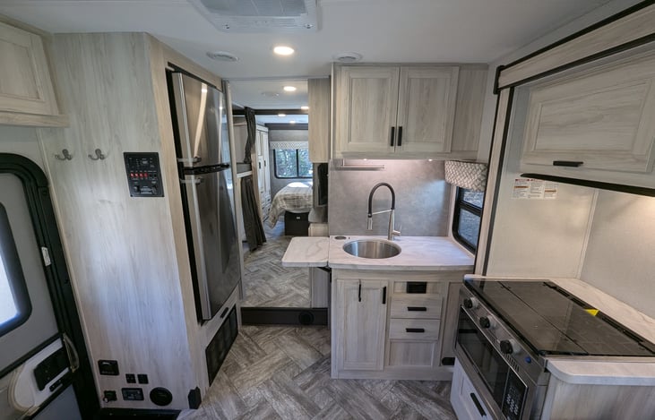 Spacious, bright & modern interior. Comfy couch and dinette both convert to beds. Large refrigerator and ample storage throughout.