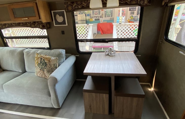 Four seater dining room table with storage under the seats.