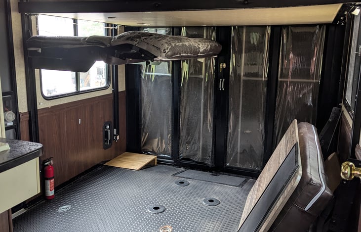 Garage area: This are is currently a work in progress and will look different once you come to stay. At the top there is a HappyJac bed system that fits a queen bed.