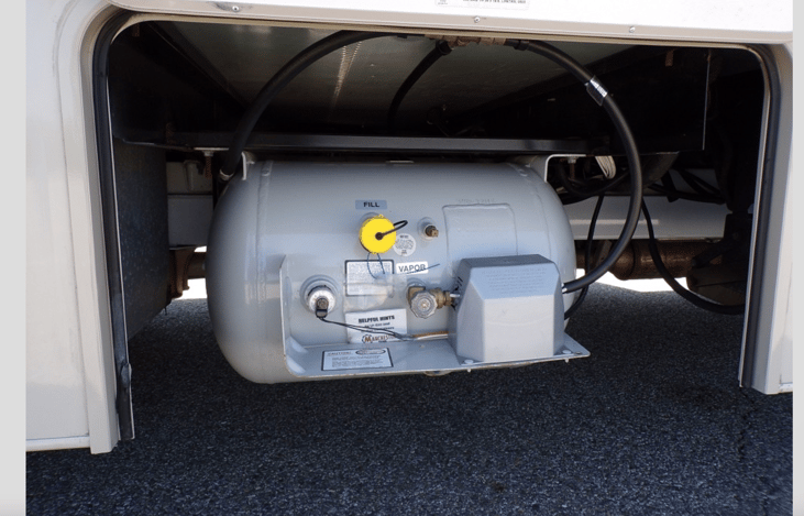 Very large LPG tank that runs the refrigerator, cook top, heater and other items in the RV.
