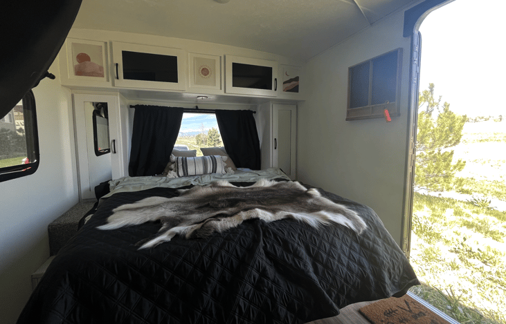 Queen bed after folder the couch down.