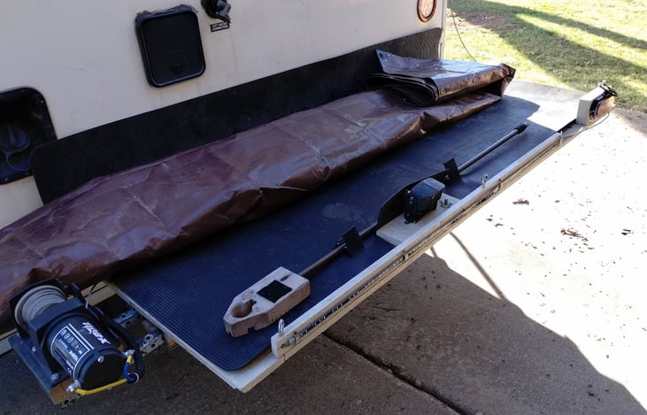 Rear platform with rubber top.  Optional tarp, winch, ramps, stretch tie down