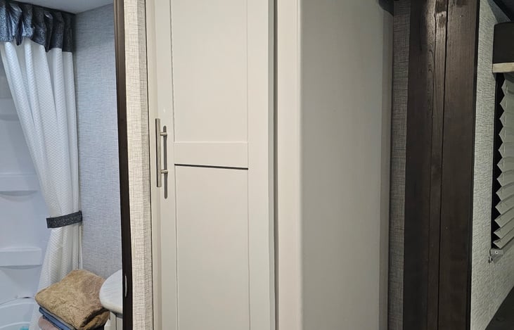 This camper features a deep pantry for all the family cookouts.