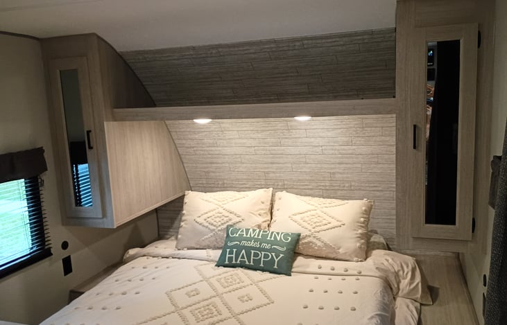 Front queen sized bed with comfy new mattress.