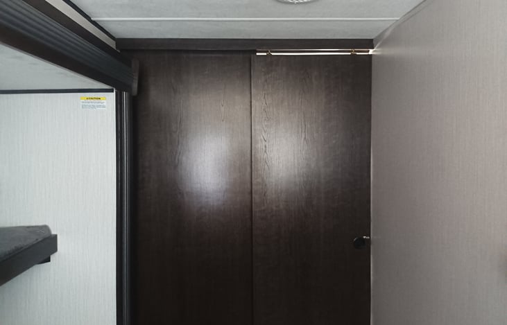 Showing door fully closes in the back bedroom