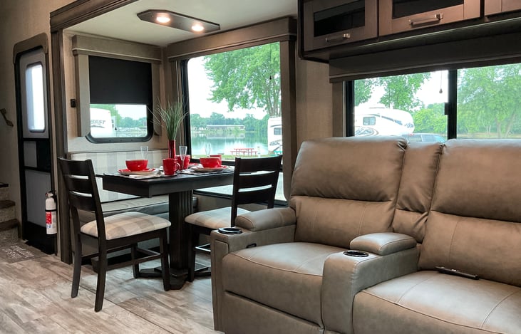 Recliners have lots of cabinet space above them. Center arm rest provides a handy space to store the remotes for the Media Center, TV and Fireplace.