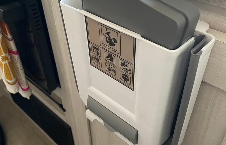 Expandable trash can in kitchen, you will find additional bags in the gray section at bottom.