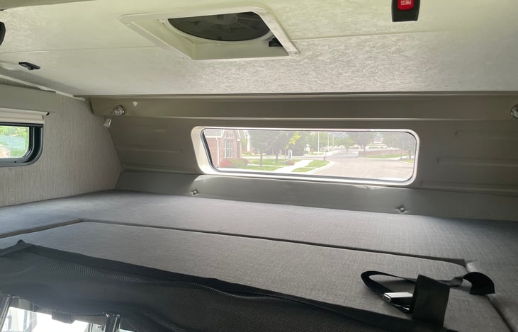 Bunkhouse bed with air vent/fan, tinted windows for privacy, lighting, USB port.