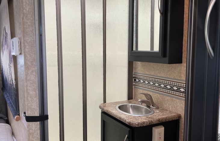 Bathroom sink and shower door closed