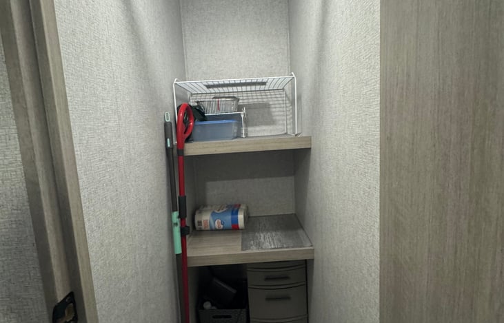 Pantry/Closet with storage bins underneath