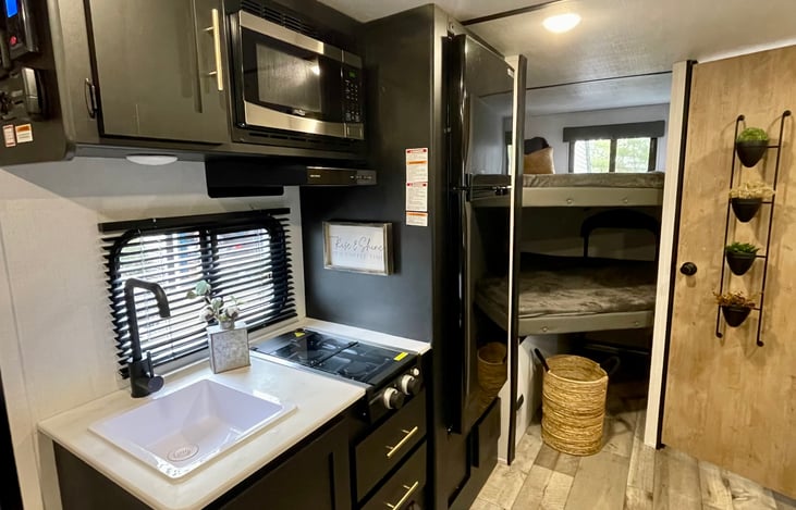 Kitchen area - 2 burner cooktop, spacious fridge & freezer, microwave, kitchen sink