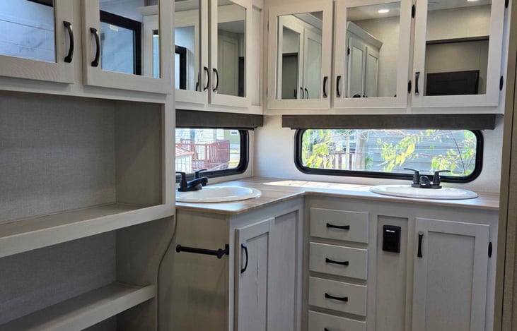 Nice bathroom two sinks with ample space.