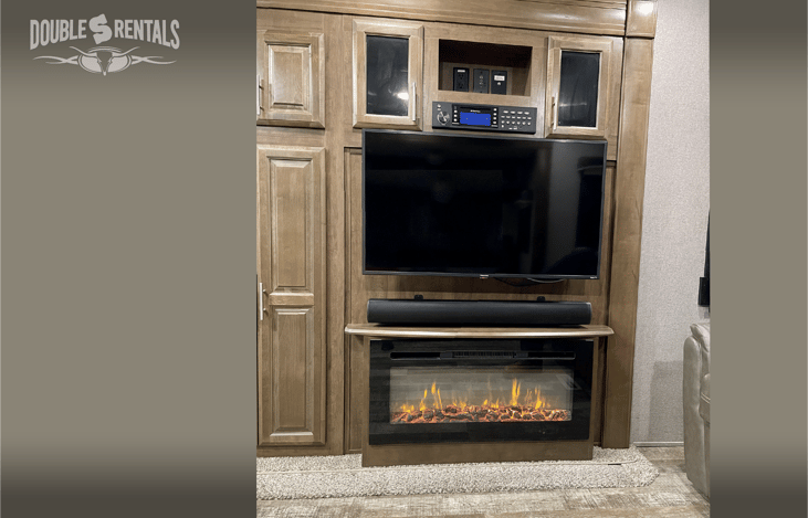 Entertainment Center with Remote-Controlled Fireplace and DVD Player/Stero in the Living Area