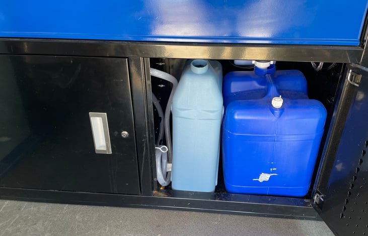 6 gallon fresh with 7 gallon waste tank. Extra 7 gallon fresh in back. Water on 12v electric pump