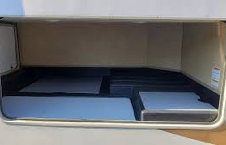 Storage underneath with outdoor table stored.