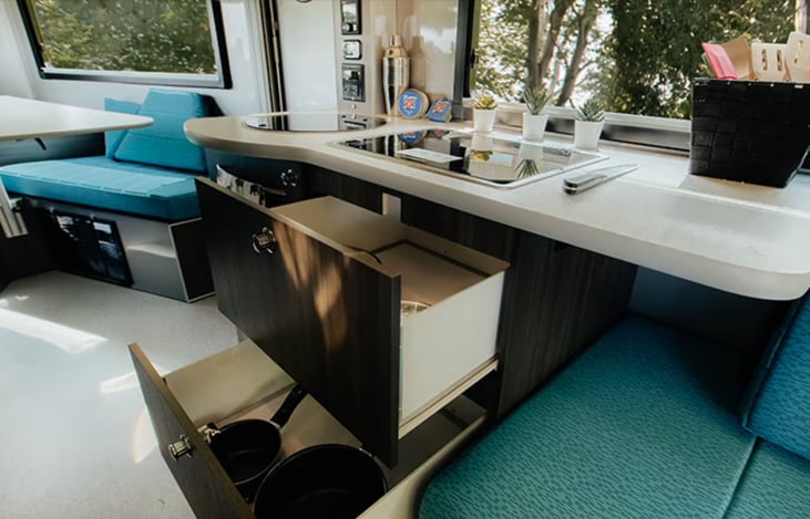 Under-stovetop pullout drawers.