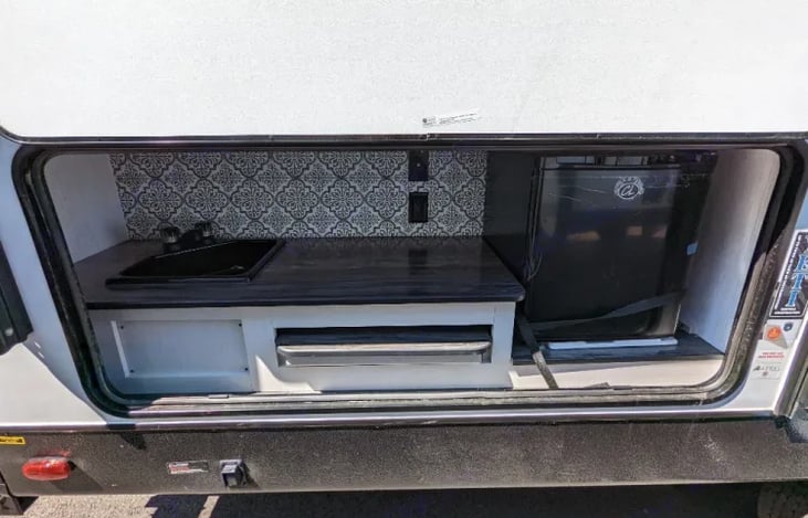 Outdoor kitchette. Sink, counter space and fridge