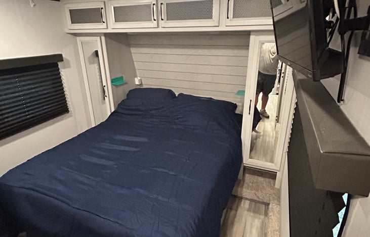 Master with queen bed and bedding.