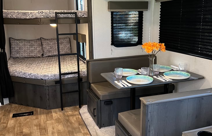 2 oversized bunks with their own light and outlet. Top bunk also has a fan.