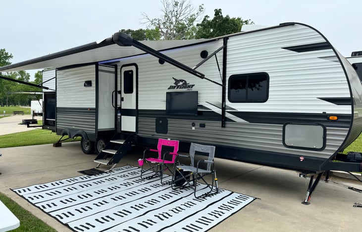 Triple slide out, outdoor kitchen and tv mount with wine guard cable hookup included