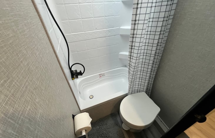 Bath with on demand water heater