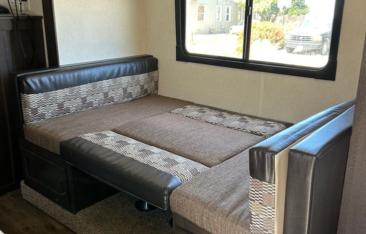 Kitchen Dinette can turn into a day bed. Linens included