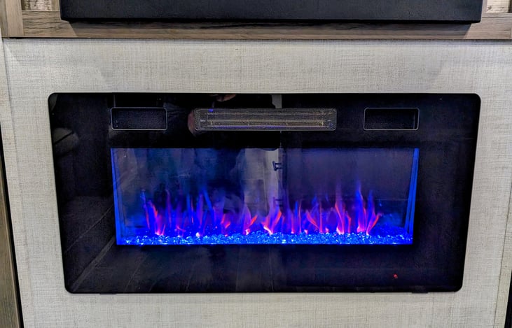 Custom installed faux fireplace with space heater and customizable LED lights