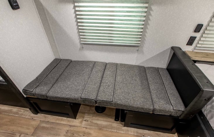 Dinette folds flat into a cozy bed.