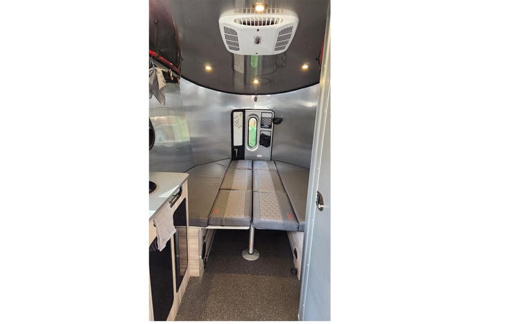 You can convert the back of the Airstream Basecamp 20X into a king-sized bed or several table configurations.