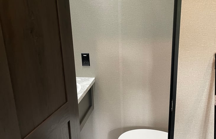 Half bath in rear bedroom.