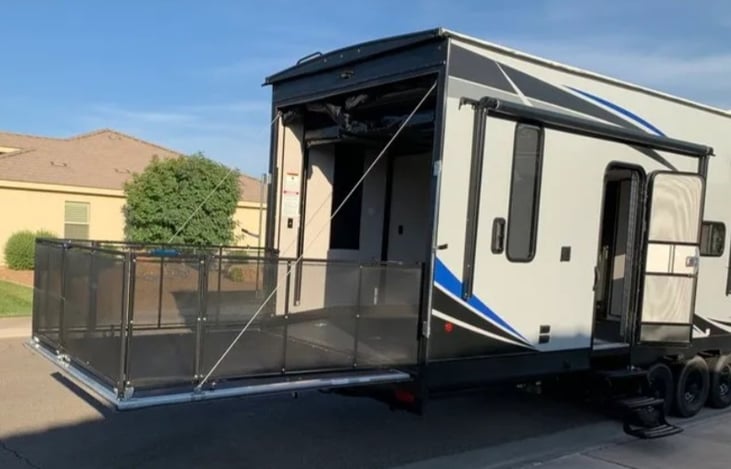 Rear gate can convert to additional outdoor patio space. Great for keeping smaller dogs contained but in the fresh air. Retractable screen dividers keep bugs out of cargo/garage space.