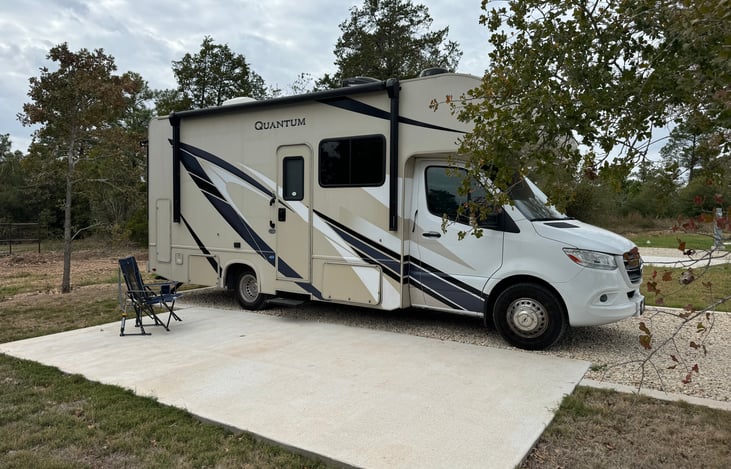 Close up of the side, multiple storage areas which open individually for storage of chairs, outdoor games, and other equipment.