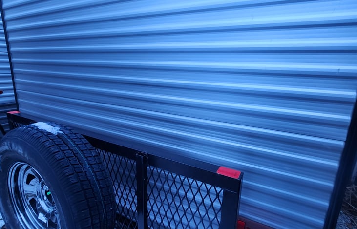 Fold down storage rack