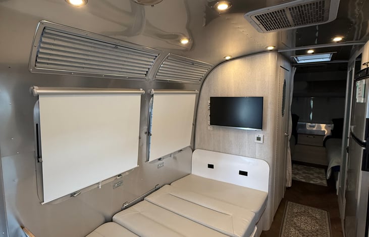 The dinette converted into a bed for up to 2 people.