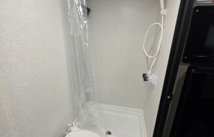 Shower with an instant hot water heater.