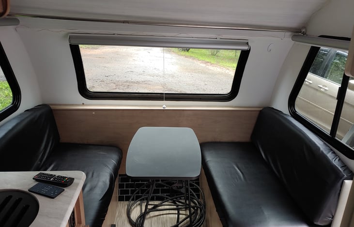 The Front Dinette has a collapsable or removable table. We keep it on the floor for when we convert this area to a TWIN bed. We take it outdoors when we want it to be our morning coffee table.