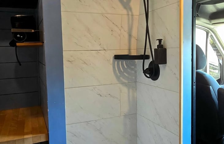 Built-in shower with removable head, wonderful to have when you're off grid and want to get cleaned off before bed.