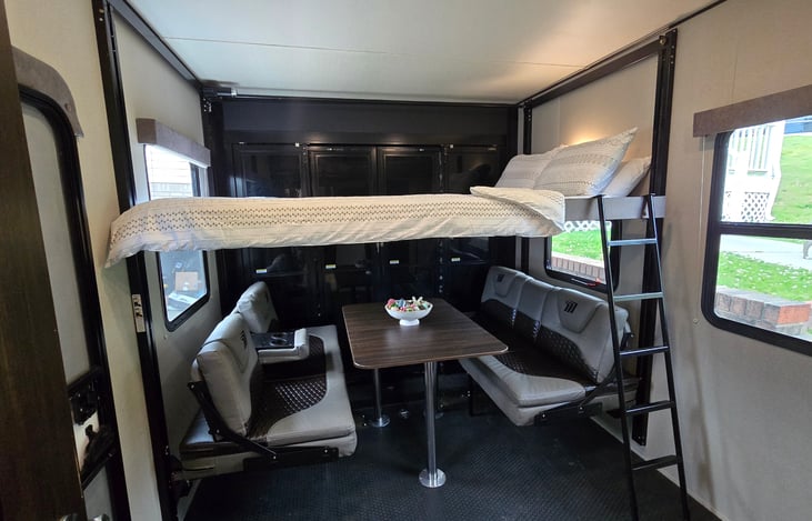 Dinning area/Garage/Bedroom
Top bunk raises to the ceiling for storage during the day.