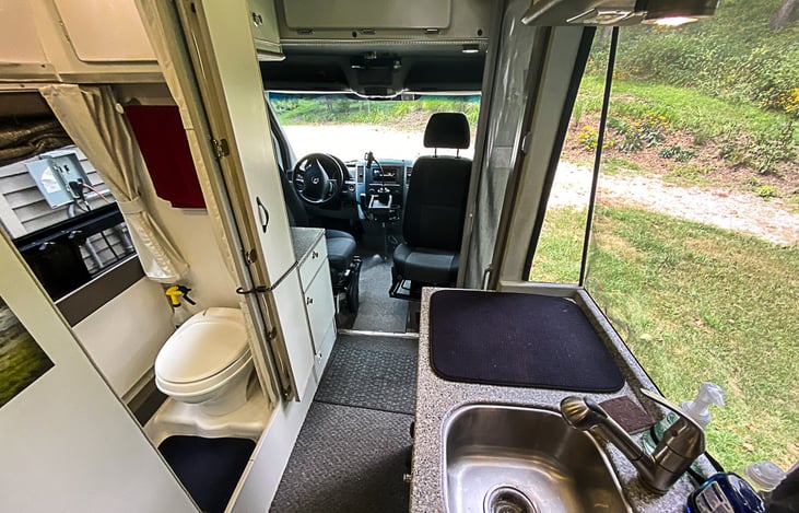 Full bath with sink, toilet and hot shower.