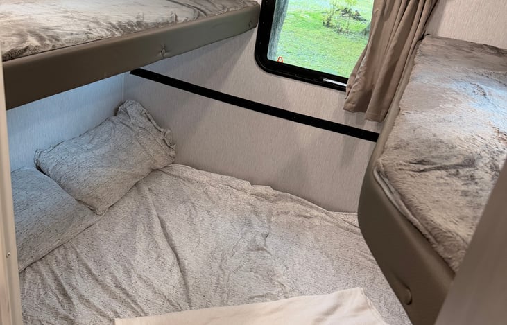 Bunkhouse with bunks ready and couch folded down into the bed position!