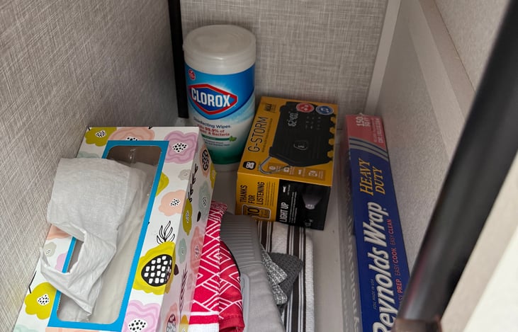 Tissues, extra hand towels, tin foil and emergency radio
