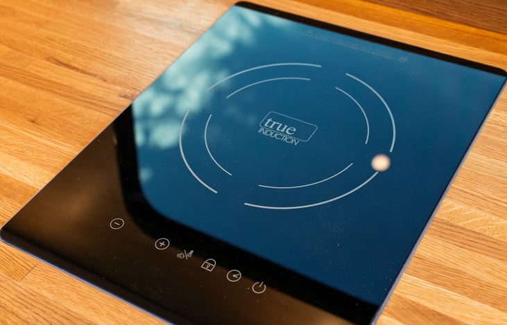 Induction cooktop. Basic pots/pans are provided, as well as an optional outdoor grill.