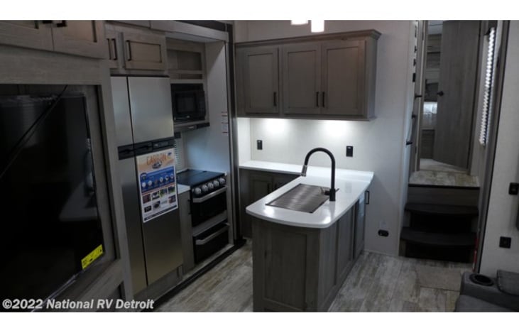 Kitchen , living space photo taken from the door entrance to the garage area