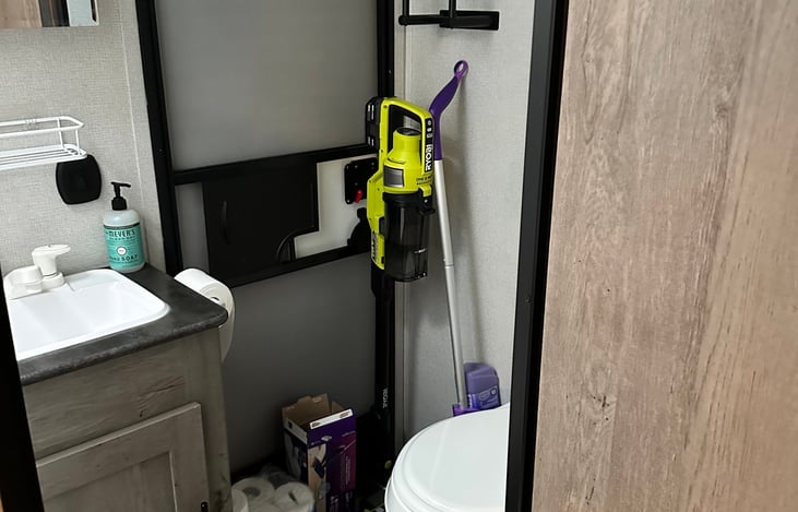 Ryobi charger, stick vac, and hand vac present. As well as swiffer mop. Stocked toilet paper.