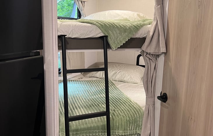 Full size bunk beds with privacy curtains