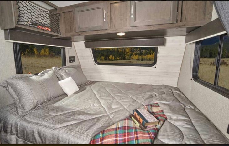 Queen bed with plenty of windows for viewing