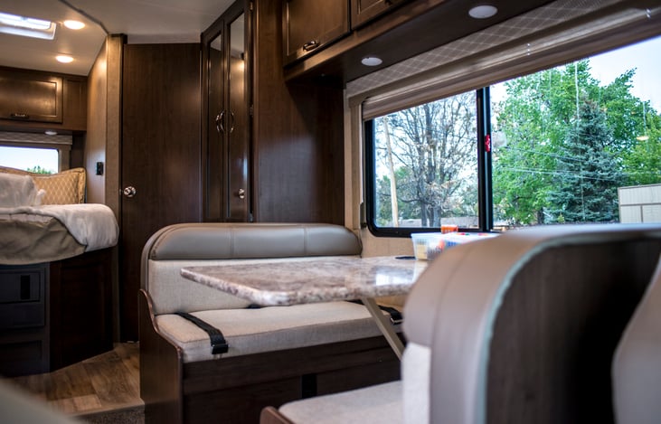 Dinette seats 4 and converts to a bed that sleeps 2.